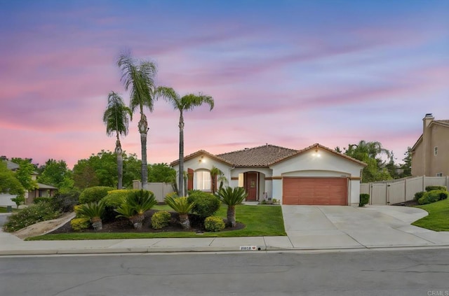 31920 Pasos Pl, Temecula, CA 92591 - mediterranean / spanish-style home with a garage, concrete driveway, stucco siding, a gate, and a tile roof