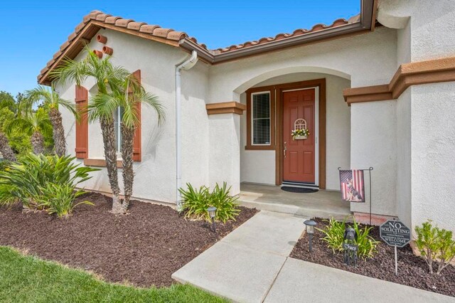 31920 Pasos Pl, Temecula, CA 92591 - doorway to property with stucco siding and a tile roof