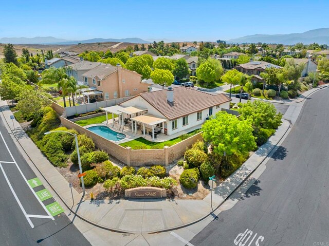 31920 Pasos Pl, Temecula, CA 92591 - aerial view of residential area with a mountainous background and a pool area