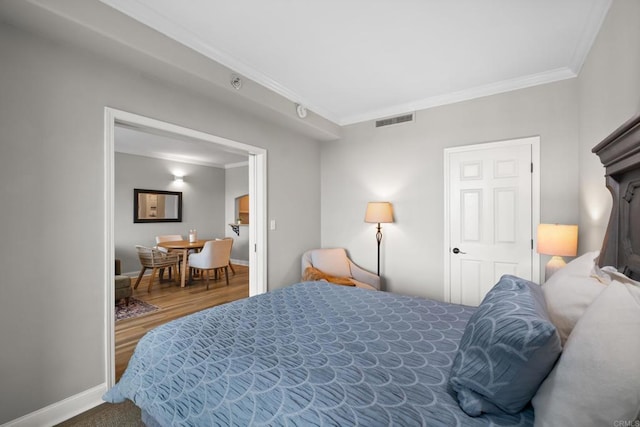 3890 Nobel Dr Unit 1505, San Diego, CA 92122 - bedroom featuring ornamental molding and wood finished floors