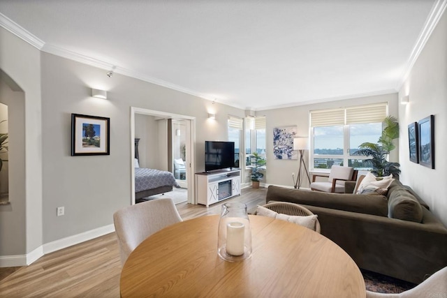 3890 Nobel Dr Unit 1505, San Diego, CA 92122 - living area featuring crown molding, light wood-style floors, and arched walkways