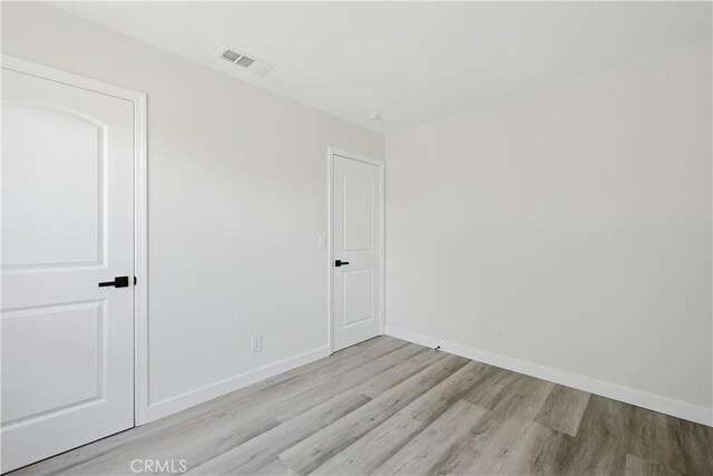 44242 Benald St, Lancaster, CA 93535 - unfurnished bedroom featuring light wood-style flooring and baseboards