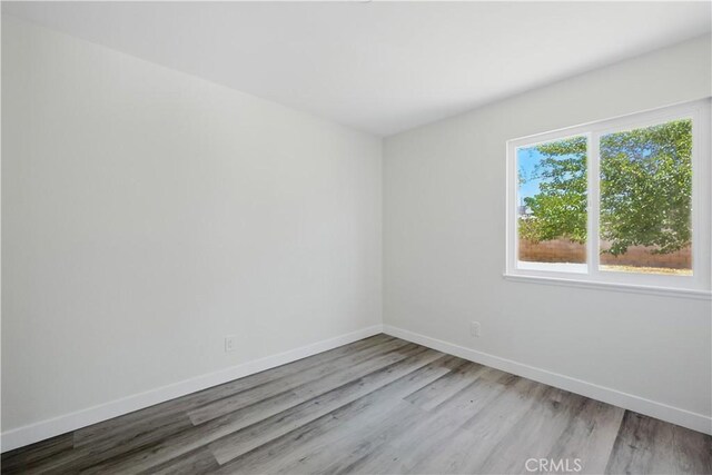 44242 Benald St, Lancaster, CA 93535 - empty room with wood finished floors and baseboards