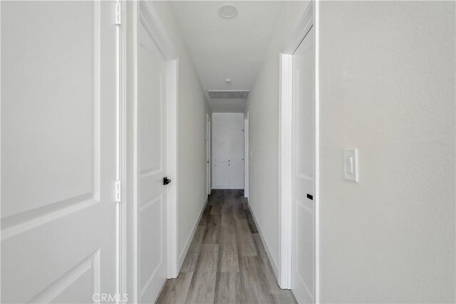 44242 Benald St, Lancaster, CA 93535 - hallway with light wood-style flooring and baseboards