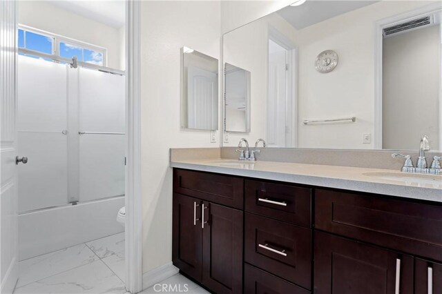1600 Liv Ct, Redlands, CA 92374 - bathroom with marble finish flooring, double vanity, toilet, combined bath / shower with glass door, and baseboards