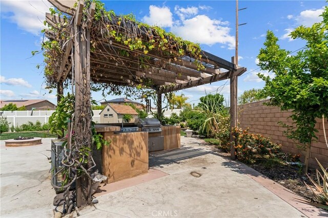 1600 Liv Ct, Redlands, CA 92374 - fenced backyard with a patio, a pergola, and a sink