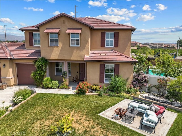 1600 Liv Ct, Redlands, CA 92374 - view of front of house featuring stucco siding, a tiled roof, an outdoor living space, and concrete driveway