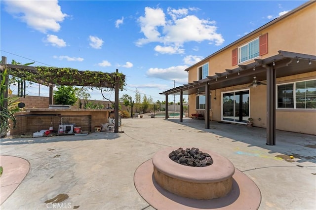 1600 Liv Ct, Redlands, CA 92374 - fenced backyard with a patio area, a ceiling fan, and a fire pit