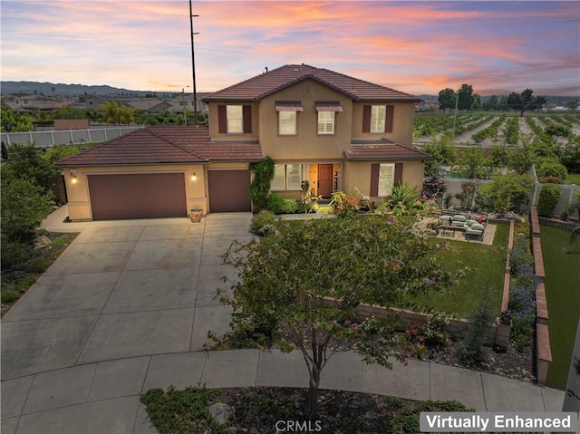 1600 Liv Ct, Redlands, CA 92374 - view of front of property featuring a tiled roof, concrete driveway, an attached garage, and stucco siding