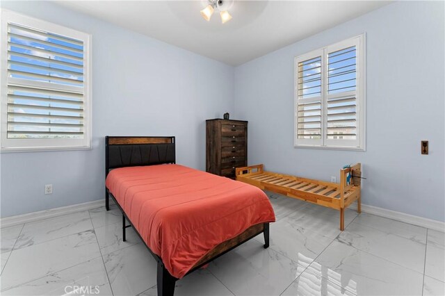 1600 Liv Ct, Redlands, CA 92374 - bedroom featuring light marble finish floors and baseboards