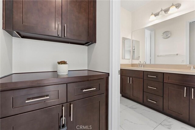 1600 Liv Ct, Redlands, CA 92374 - bathroom featuring marble look tiles and double vanity