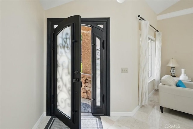 25009 Wintergreen Ct, Stevenson Ranch, CA 91381 - foyer entrance with vaulted ceiling, plenty of natural light, and baseboards