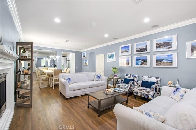 543 Garden Ave, Pomona, CA 91767 - living area featuring crown molding, wood finished floors, a fireplace, recessed lighting, and a chandelier