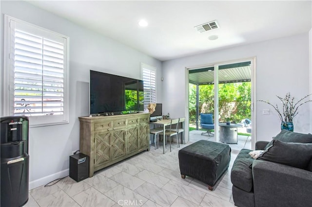 543 Garden Ave, Pomona, CA 91767 - living room featuring light marble finish floors and recessed lighting