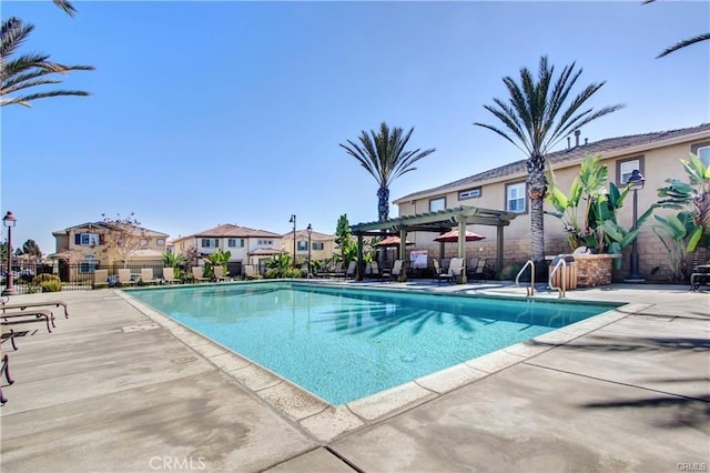 543 Garden Ave, Pomona, CA 91767 - community pool featuring a pergola, a patio area, and a residential view