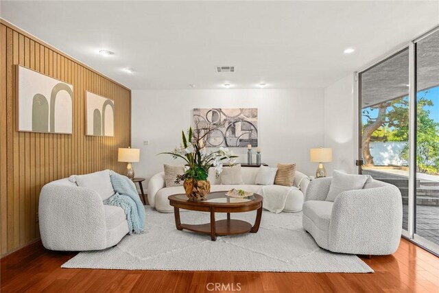 738 Hampton Rd, Arcadia, CA 91006 - living room with wood finished floors, wooden walls, and recessed lighting