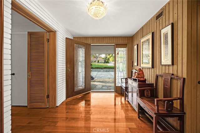 738 Hampton Rd, Arcadia, CA 91006 - foyer featuring a chandelier, wooden walls, and wood finished floors