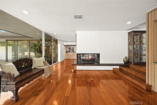 738 Hampton Rd, Arcadia, CA 91006 - living room featuring wood finished floors, a multi sided fireplace, and recessed lighting