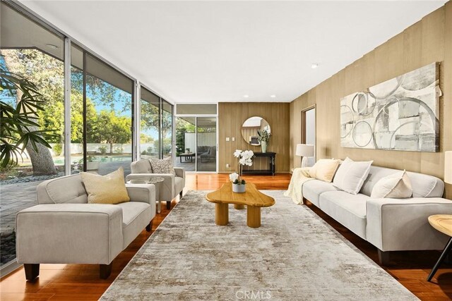 738 Hampton Rd, Arcadia, CA 91006 - living room featuring wood finished floors, floor to ceiling windows, and wooden walls