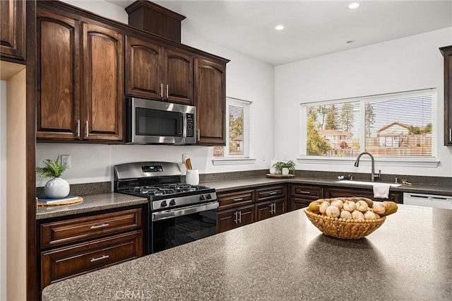 5972 Peck Ln, Paradise, CA 95969 - kitchen featuring appliances with stainless steel finishes, dark countertops, recessed lighting, and dark brown cabinetry