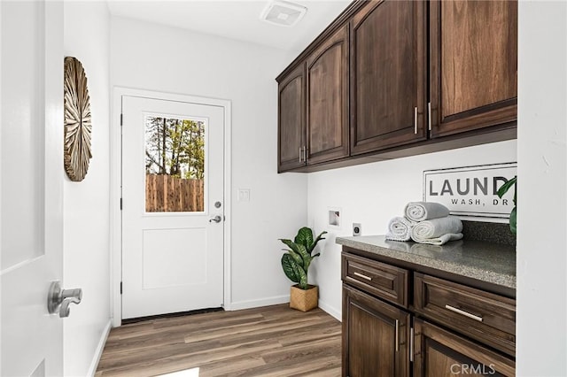 5972 Peck Ln, Paradise, CA 95969 - laundry area featuring electric dryer hookup, cabinet space, washer hookup, and wood finished floors