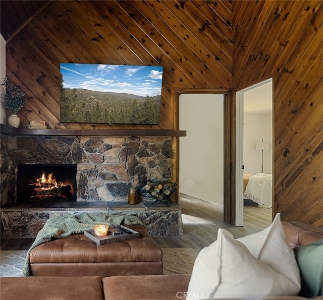 27947 St Bernard Ln, Lake Arrowhead, CA 92352 - living room featuring a fireplace, wooden walls, and wood finished floors