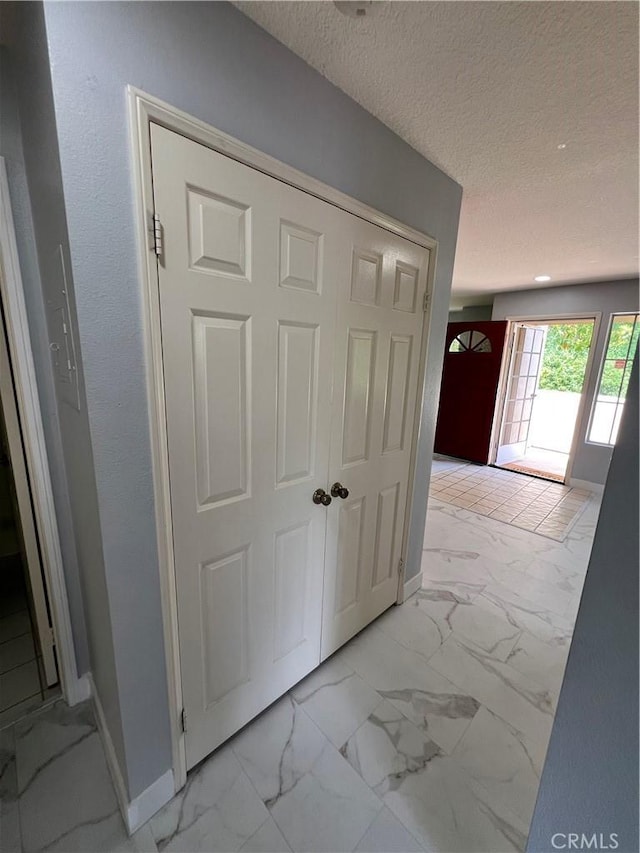 21212 Camelia Unit 46, Lake Forest, CA 92630 - detailed view of baseboards and a textured ceiling