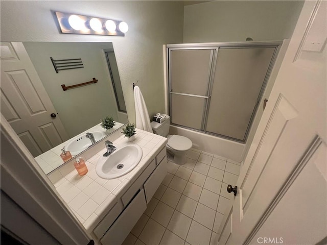 21212 Camelia Unit 46, Lake Forest, CA 92630 - bathroom with toilet, tile patterned flooring, vanity, and bath / shower combo with glass door
