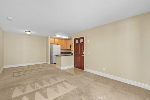 2400 San Gabriel Way Unit 205, Corona, CA 92882 - unfurnished living room with light carpet and baseboards