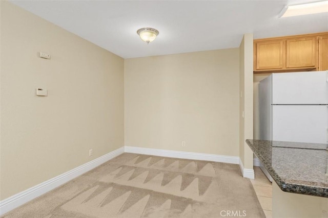 2400 San Gabriel Way Unit 205, Corona, CA 92882 - unfurnished dining area with baseboards and light colored carpet