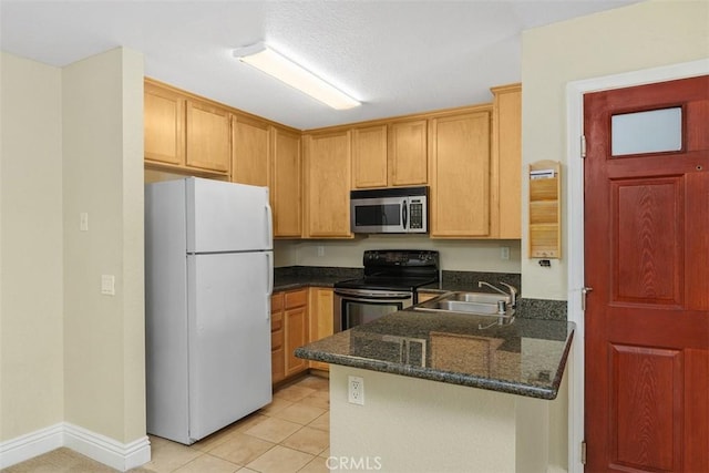 2400 San Gabriel Way Unit 205, Corona, CA 92882 - kitchen featuring freestanding refrigerator, stainless steel microwave, black range with electric cooktop, a sink, and a peninsula
