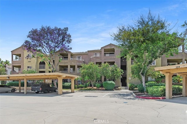 2400 San Gabriel Way Unit 205, Corona, CA 92882 - view of property with covered and uncovered parking