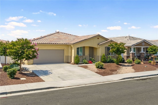 1372 Bello Pl, San Jacinto, CA 92582 - view of front of property with a garage, concrete driveway, a tile roof, and stucco siding
