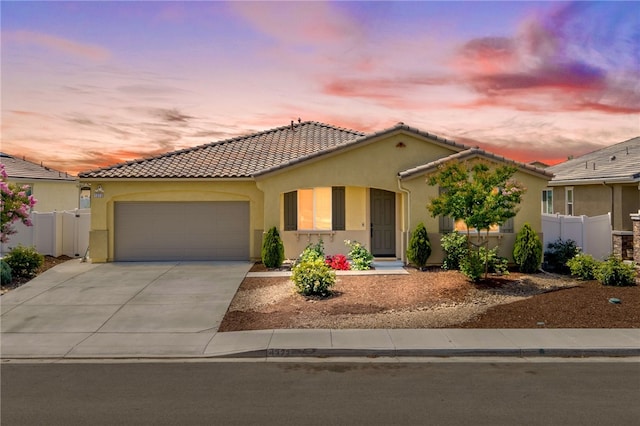 1372 Bello Pl, San Jacinto, CA 92582 - mediterranean / spanish home with an attached garage, stucco siding, concrete driveway, and a tiled roof