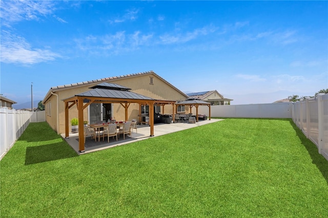 1372 Bello Pl, San Jacinto, CA 92582 - back of property with a gazebo, a patio area, stucco siding, and a tiled roof