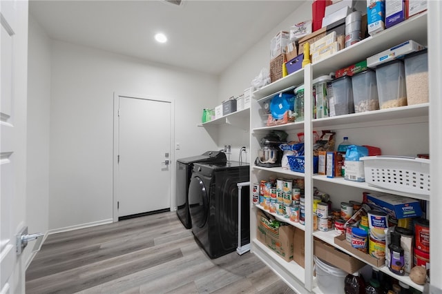 1372 Bello Pl, San Jacinto, CA 92582 - laundry area with washing machine and clothes dryer, wood finished floors, and recessed lighting
