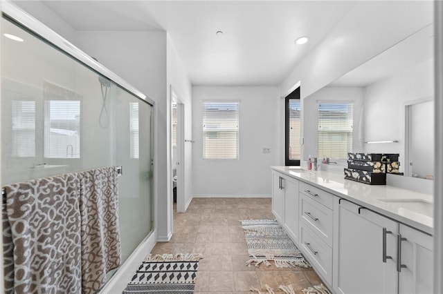 1372 Bello Pl, San Jacinto, CA 92582 - bathroom with a stall shower, double vanity, baseboards, and recessed lighting