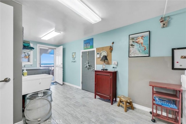 6309 Via Colinita, Rancho Palos Verdes, CA 90275 - bathroom with washer and clothes dryer, baseboards, and wood finished floors