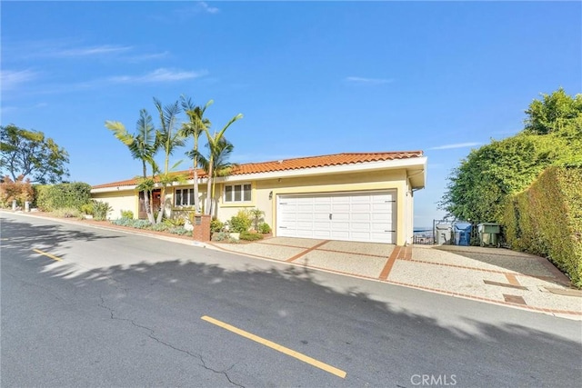 6309 Via Colinita, Rancho Palos Verdes, CA 90275 - view of front of house with a garage, a tiled roof, stucco siding, and driveway