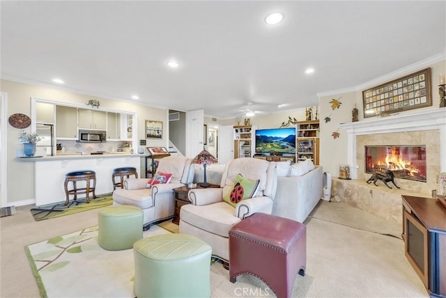 6309 Via Colinita, Rancho Palos Verdes, CA 90275 - living area featuring a fireplace, crown molding, ceiling fan, recessed lighting, and light carpet