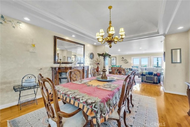 6309 Via Colinita, Rancho Palos Verdes, CA 90275 - dining space featuring a chandelier, crown molding, wood finished floors, a raised ceiling, and baseboards