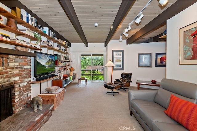 27280 Peninsula Dr, Lake Arrowhead, CA 92352 - living room featuring carpet flooring, beamed ceiling, track lighting, and a fireplace