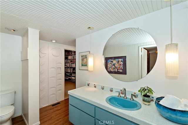 27280 Peninsula Dr, Lake Arrowhead, CA 92352 - bathroom featuring vanity, toilet, and wood finished floors