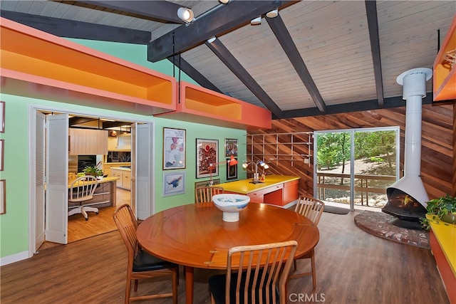 27280 Peninsula Dr, Lake Arrowhead, CA 92352 - dining room featuring a wood stove, wood finished floors, and wooden walls