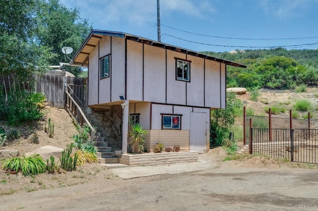 17620 Lyons Valley Rd, Jamul, CA 91935 - view of front of house with stairs and board and batten siding