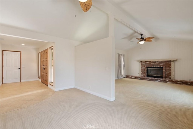 45740 Verba Santa Dr, Palm Desert, CA 92260 - unfurnished living room featuring ceiling fan, light carpet, a brick fireplace, and light tile patterned floors