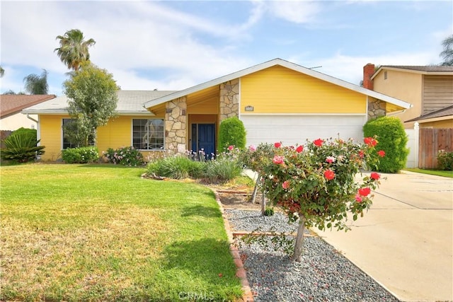 4163 Alma Ct, Chino, CA 91710 - view of front of house with stone siding, a garage, and driveway