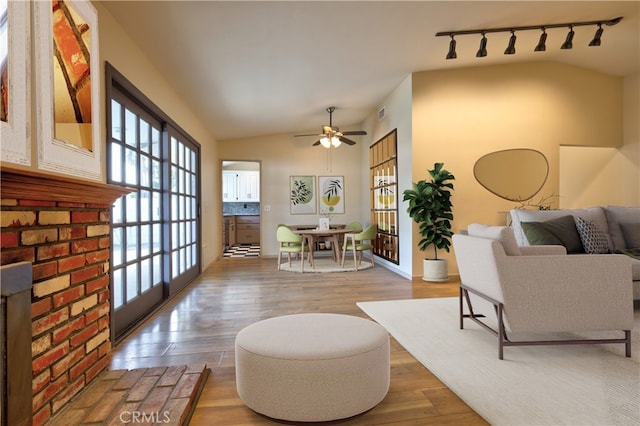 4163 Alma Ct, Chino, CA 91710 - living room featuring track lighting, lofted ceiling, ceiling fan, and wood finished floors
