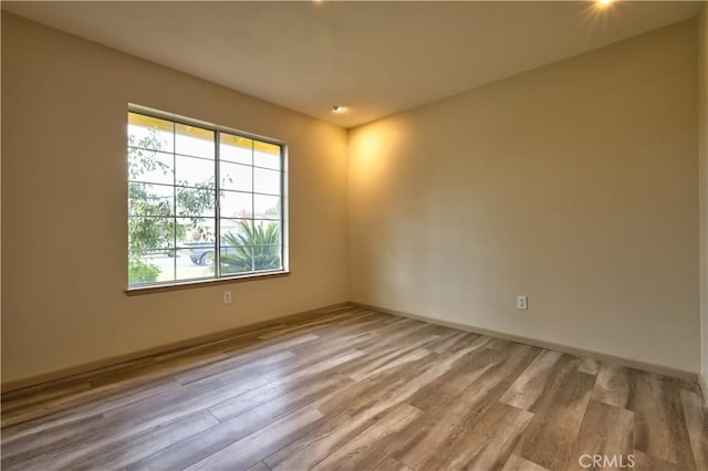 4163 Alma Ct, Chino, CA 91710 - empty room with wood finished floors and baseboards