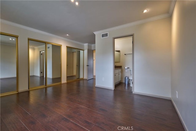 4163 Alma Ct, Chino, CA 91710 - unfurnished bedroom featuring dark wood finished floors, two closets, ornamental molding, ensuite bath, and recessed lighting